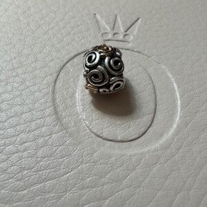 Genuine retired Pandora two tone swirl charm
